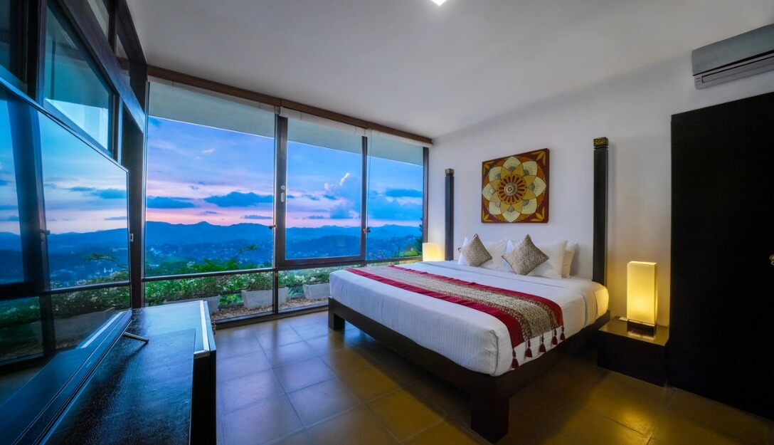 Deluxe room offering beautiful evening views at Theva Residency