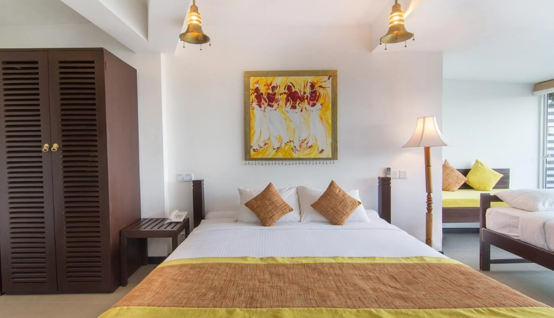 Stylish bed and wardrobe at Theva Superior Ground Rooms