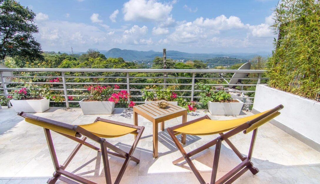 Charming balcony with picturesque Hanthana views at Theva Residency Kandy