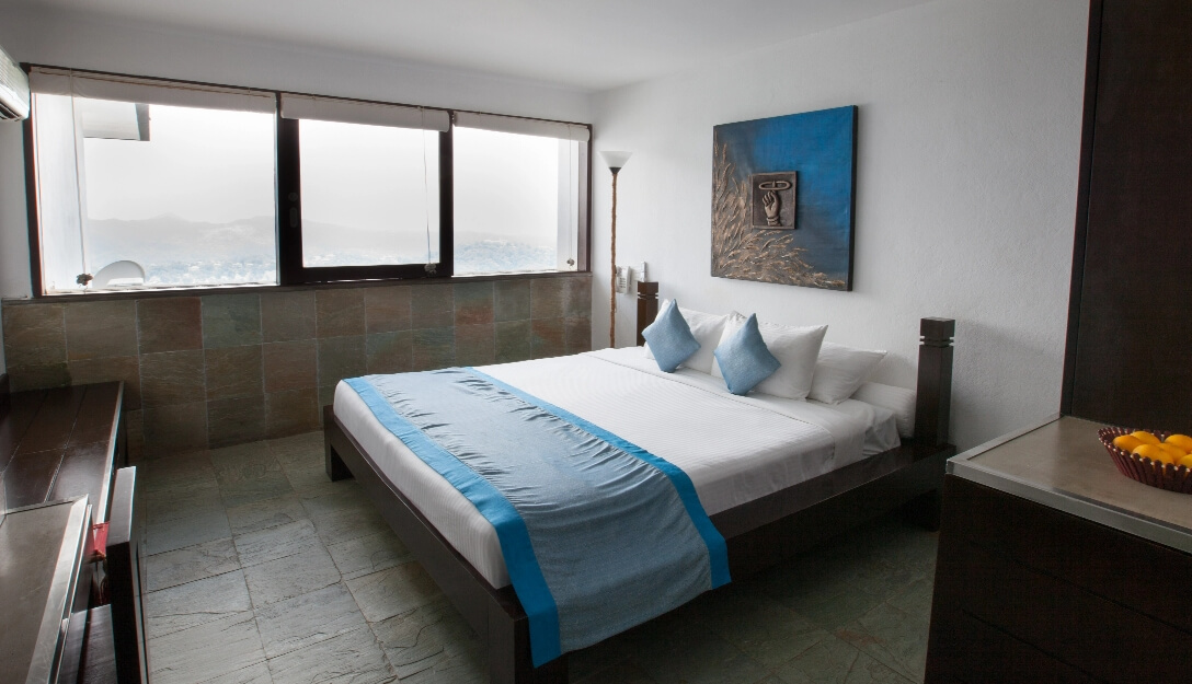 Deluxe room with elegant marble floor at Theva Residency Kandy