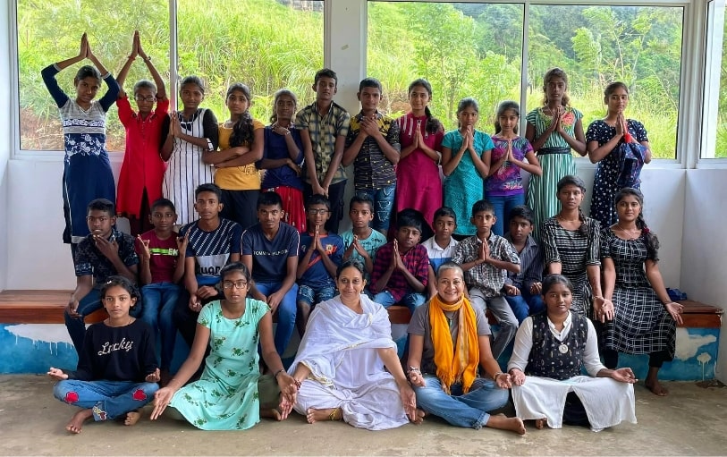 Smiling children engaged in Theva Residency Kandy Seva initiative