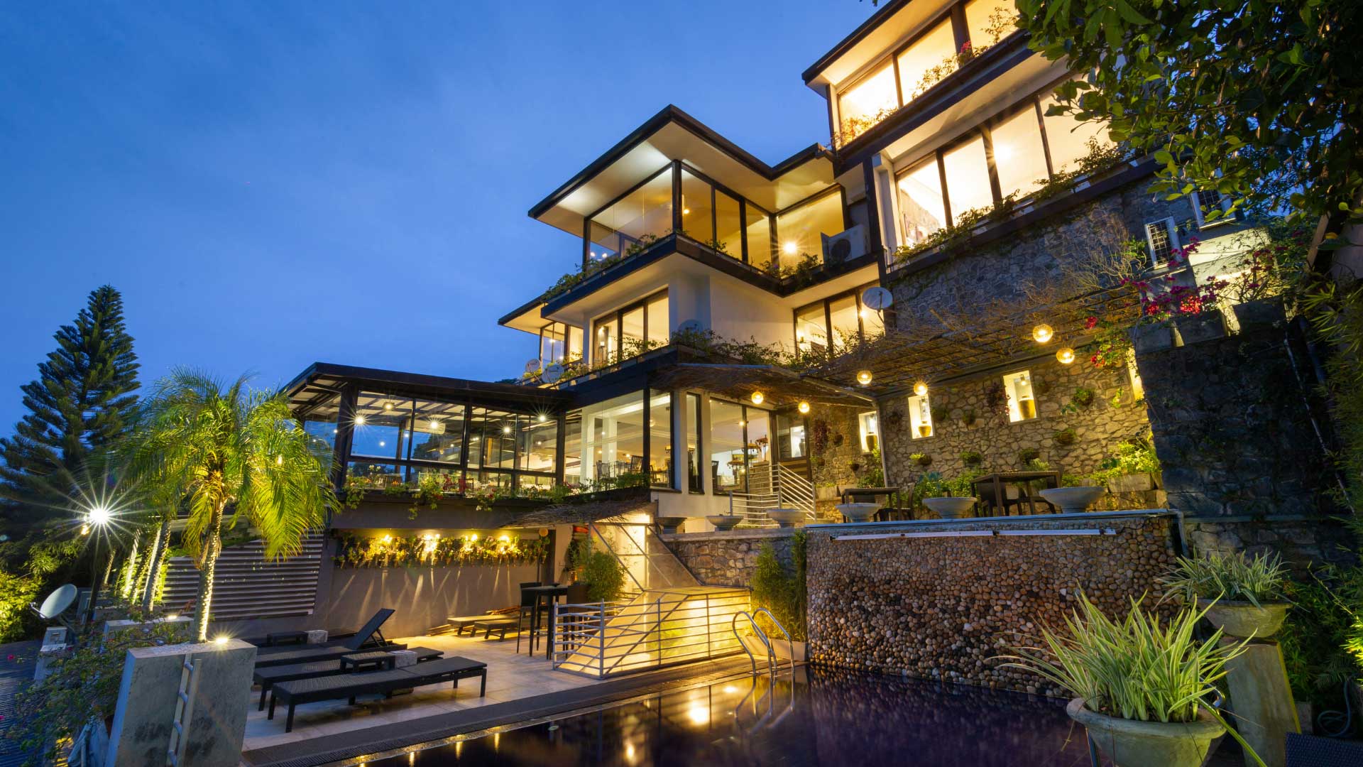 Nighttime elegance of Theva Residency with scenic surroundings