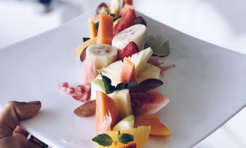 Exquisite fruit platter dessert beautifully presented at Theva Residency