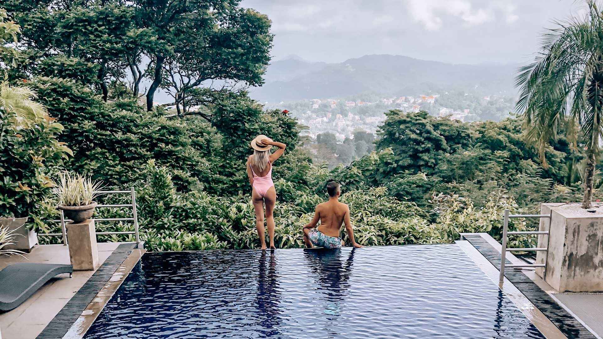 Infinity pool with panoramic Kandy mountain views at Theva Residency